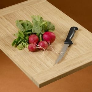 cutting board with turnips and knife