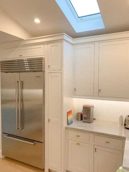 Flush Inset, Amesbury doors, Slab drawers, Crown 2 piece filler slab, & Frosty White finish