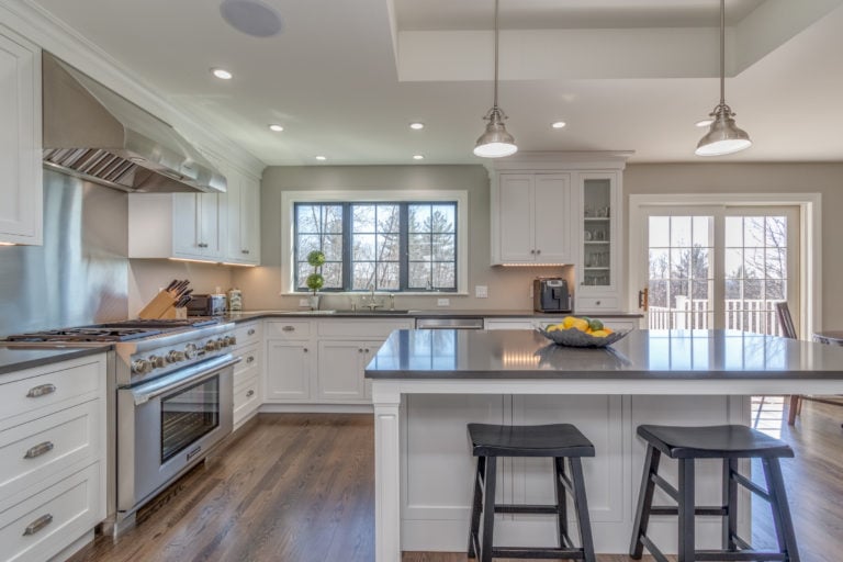 white kitchen cabinets and sitting area