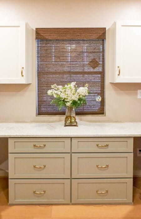 vase of flowers on top of custom countertop and drawers