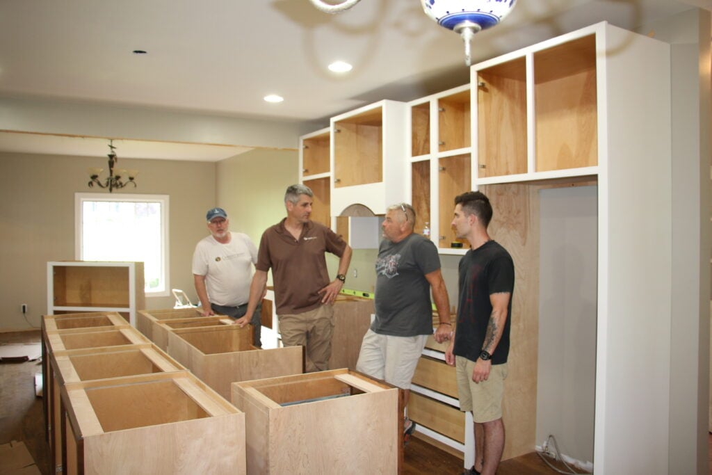 The team assembling a Cabinet Joint kitchen