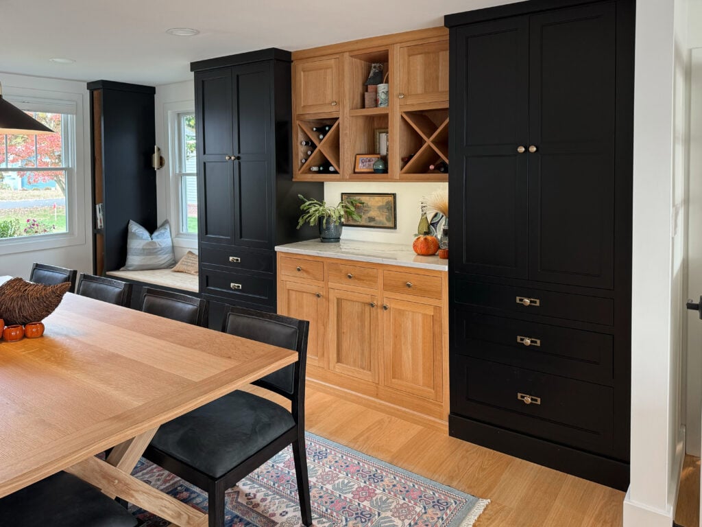 Black built-in cabinets with quarter sawn white oak inset cabinets and wine storage