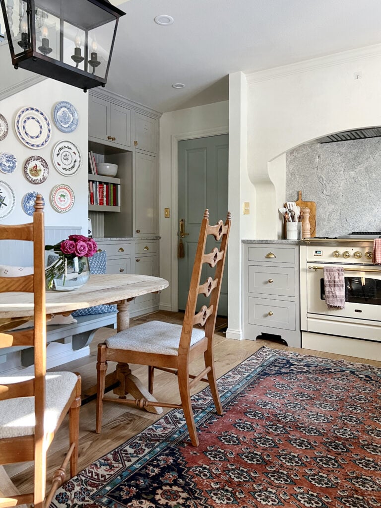 Inset kitchen cabinets with arched feet and cookbook shelves