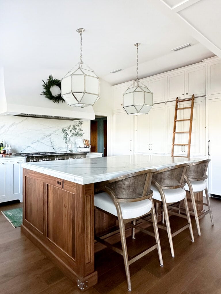 Walnut island with kitchen ladder and plaster range hood