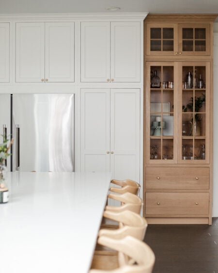 Flush Inset, TW-10 door with regular framing bead, Slab drawer fronts, Frosty White. Island & Tall Cabinet: Rift Cut White Oak (finished by customer)