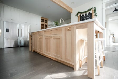 Flush Inset, TW-10 door with regular framing bead, Slab drawer fronts, Frosty White. Island & Tall Cabinet: Rift Cut White Oak (finished by customer)