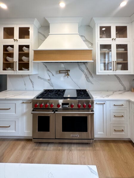 Flush Inset, Painted Arctic White Colourtone, White Oak, Nutmeg wiping stain, Crawford doors & drawerfronts (top slab), Large Cove 2618, Inset Shaker Light Rail 2671